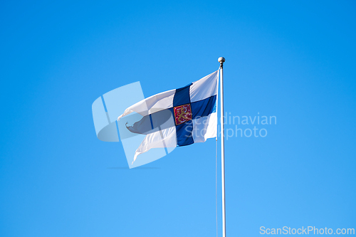 Image of Finnish flag with the coat of arms