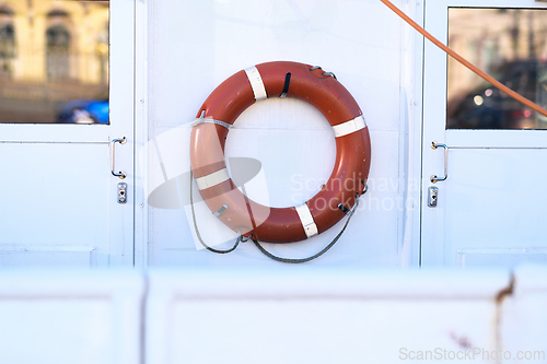 Image of A red lifebuoy on a ship