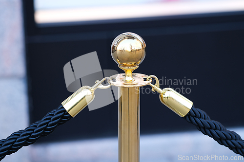 Image of Golden Pole of a Rope Fence