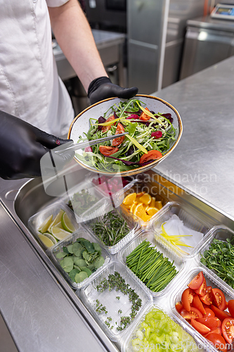 Image of Chef preparing fresh salad