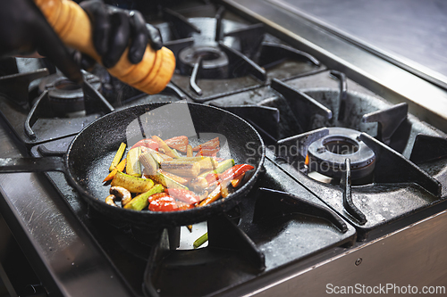 Image of Chef adding spices