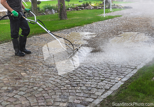 Image of Cleaning service worker using a surface cleaner
