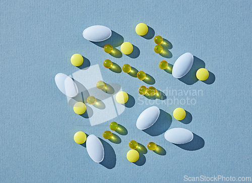 Image of various pills on blue background