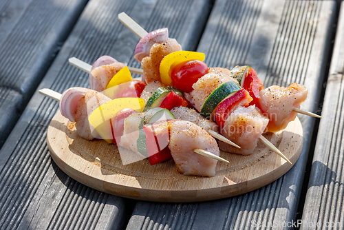 Image of raw chicken and vegetable skewers