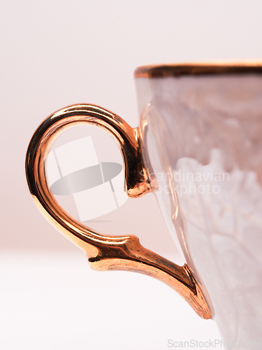 Image of Golden cup handle