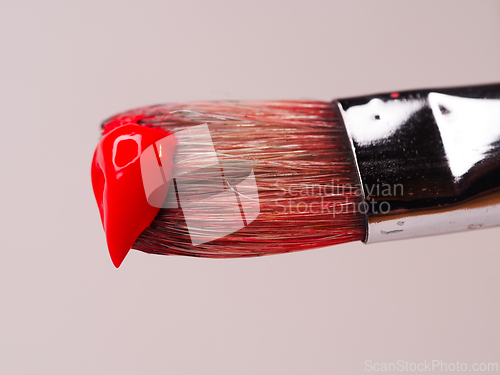 Image of Paint brush with red paint