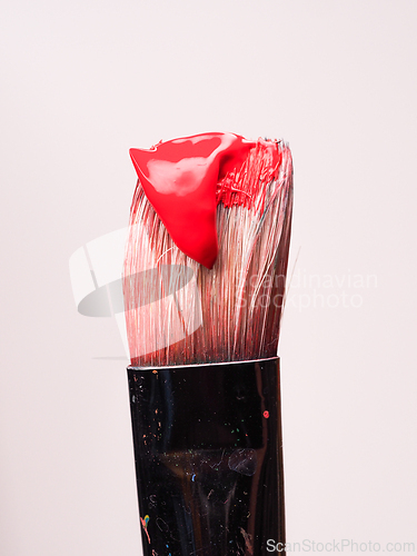 Image of Paintbrush with red paint