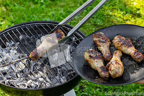 Image of chicken legs on a grill