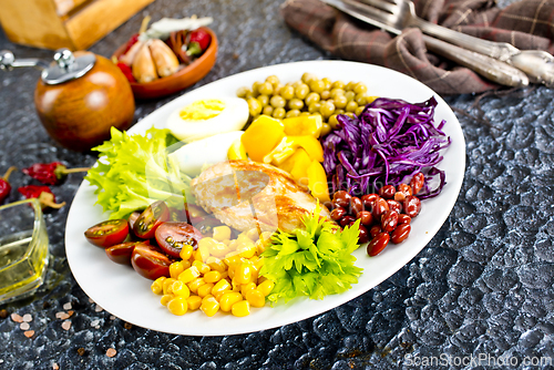 Image of Plate of salad. Salad, healthy food consist of lettuce, tomatoes, corn, carrot, boiled egg, chicken