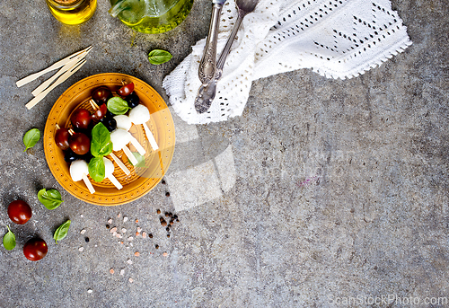 Image of A plate with Italian salad caprese canape
