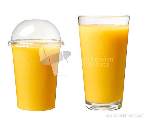 Image of yellow smoothie in various glasses