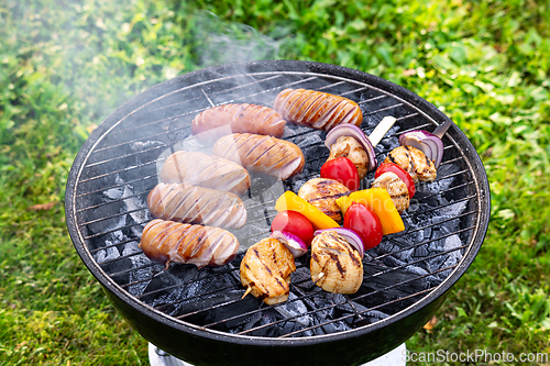 Image of grilled sausages and skewers