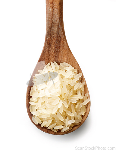 Image of raw rice in wooden spoon