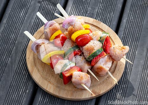 Image of raw chicken and vegetable skewers