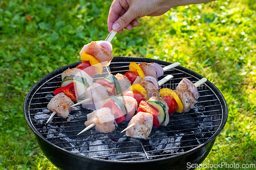 Image of raw chicken and vegetable skewers