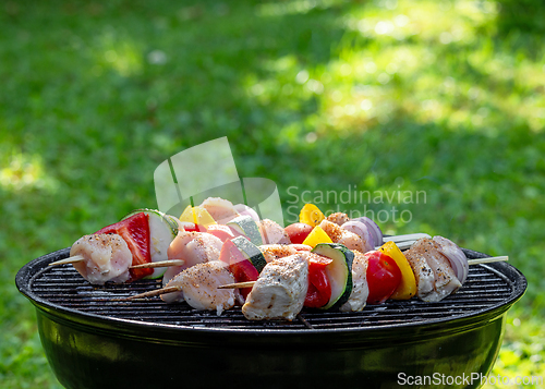 Image of raw chicken and vegetable skewers