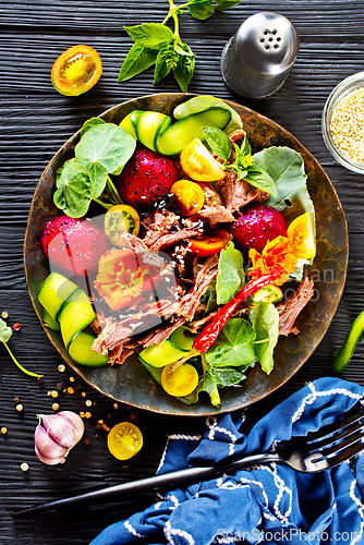 Image of salad with meat and dragon fruit< vegetable with metat