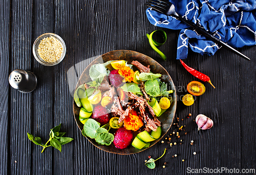 Image of salad with meat and dragon fruit< vegetable with metat