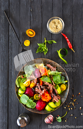 Image of salad with meat and dragon fruit< vegetable with metat