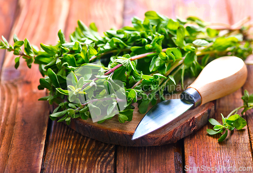 Image of marjoram on a wooden rustic table