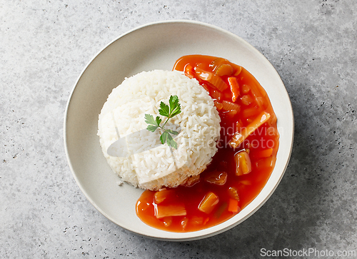 Image of boiled basmati rice with sweet and sour sauce