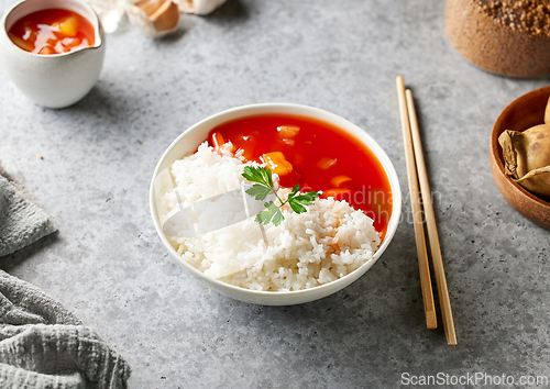 Image of boiled basmati rice with sweet and sour sauce
