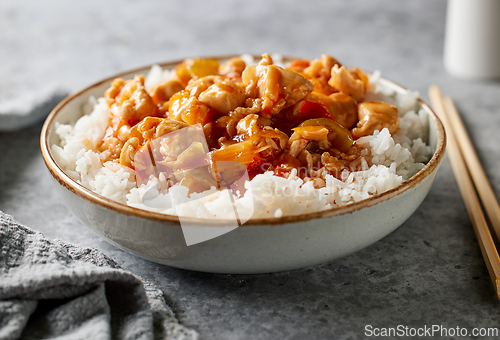 Image of bowl of boiled rice with sweet and sour sauce