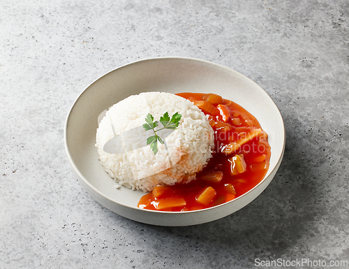 Image of boiled basmati rice with sweet and sour sauce