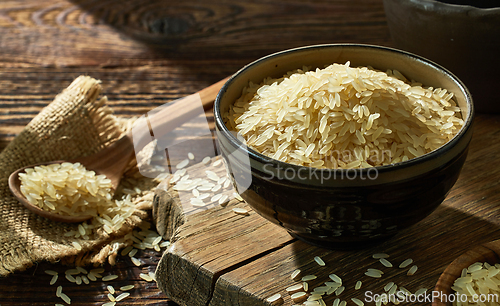Image of bowl and spoon of raw rice