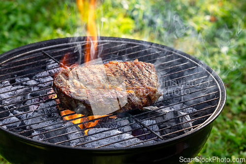 Image of beef steak on grill