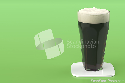 Image of Glass of dark beer on white coaster