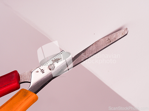 Image of Scissors cutting paper