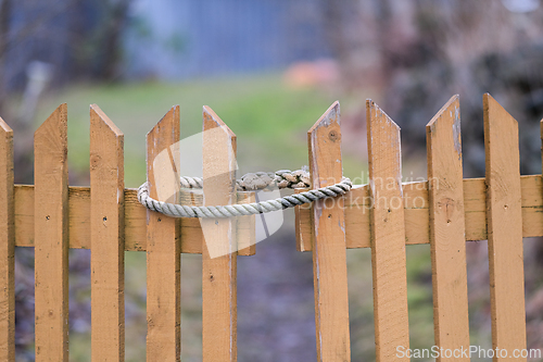Image of Fence gate with a rope