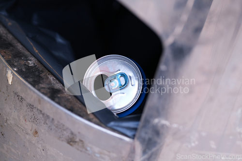 Image of A drinking can in trash
