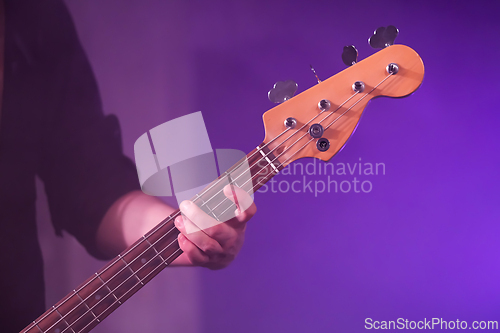 Image of Playing bass guitar