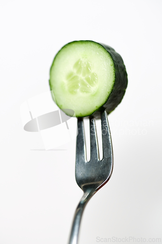 Image of Slice of cucumber on a fork