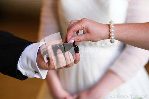 Image of Taking out  a wedding ring