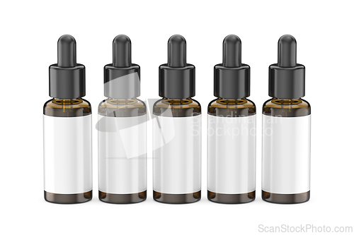 Image of Row of brown glass dropper bottles with white blank labels