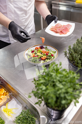 Image of Chef adding smoked salmon