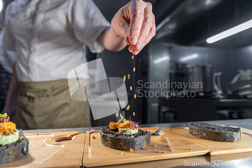 Image of Chef adding finishing touches