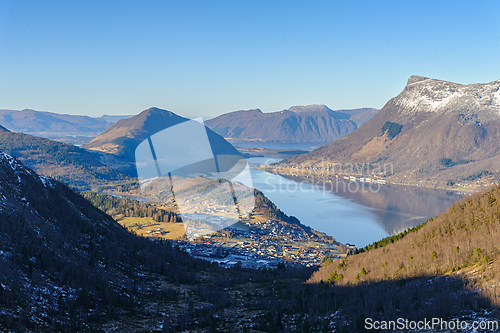 Image of Majestic fjord landscape at dusk showcasing serene water and mou
