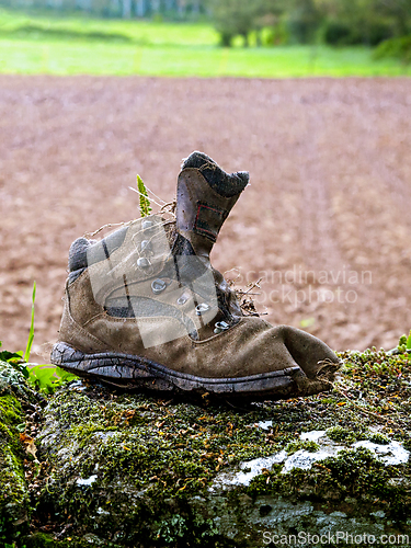 Image of An old discarded trekking boot