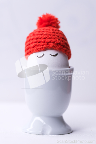 Image of Sleeping egg with a red hat