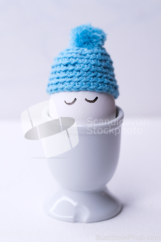 Image of Sleeping egg with a blue hat