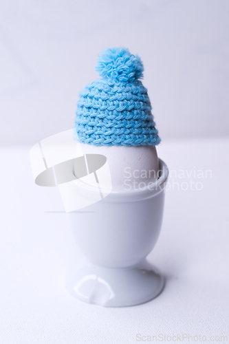Image of An egg with a hat