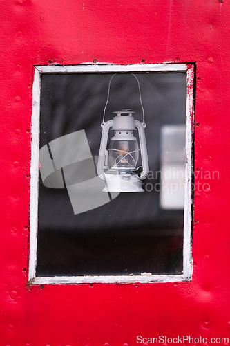Image of Oli lamp in a window