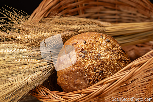 Image of Round loaf of bread covered in seeds