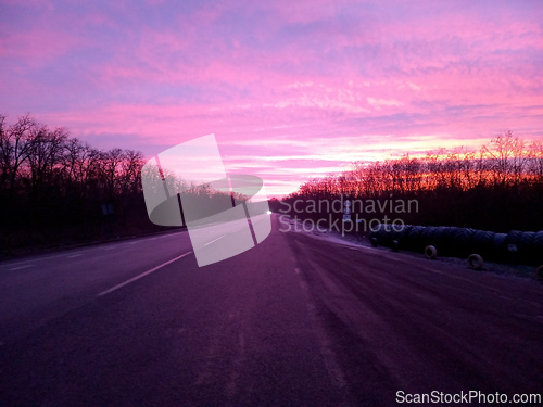 Image of red clouds and road