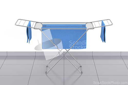 Image of Towels on a clothes drying rack