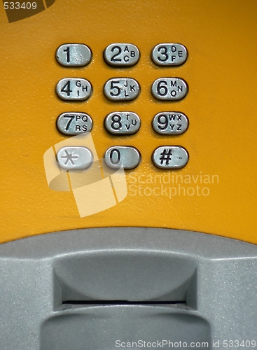 Image of Public phone yellow keypad